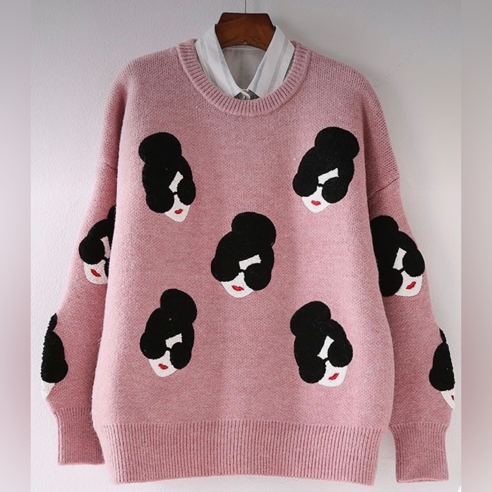Like new, pink pullover crewneck sweater with lady’s face wearing sunglasses